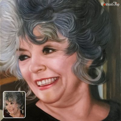 A vintage portraits of an old woman who is smiling