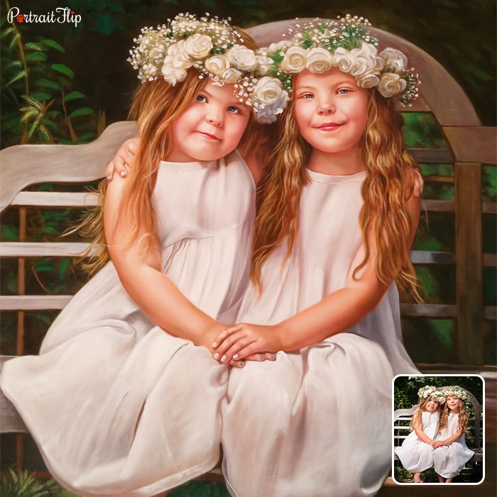 Child portraits of two girls sitting on a wooden bench wearing an angel outfit with tiara on their heads