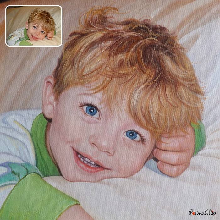 Child portraits of a boy who is smiling while lying on the bed
