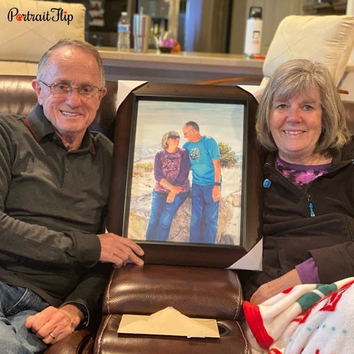 Happy PortraitFlip customer holding their hand-painted portrait